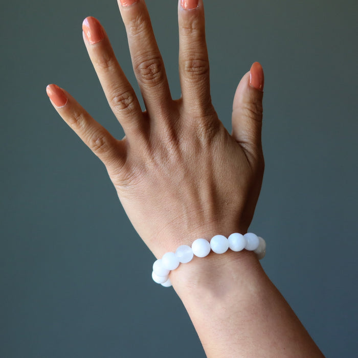 pink mangano calcite bracelet on hand