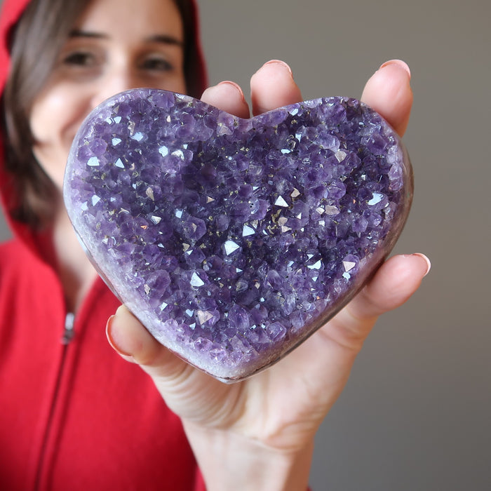female model holding 4.0-6.0 Inches Dark Purple Geode Amethyst Heart Cluster Cluster 