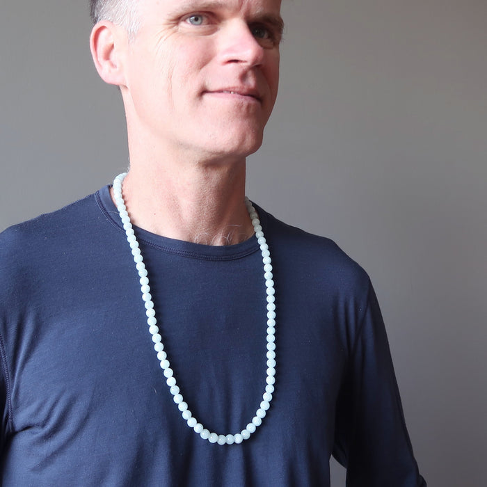 male wearing blue aquamarine necklace
