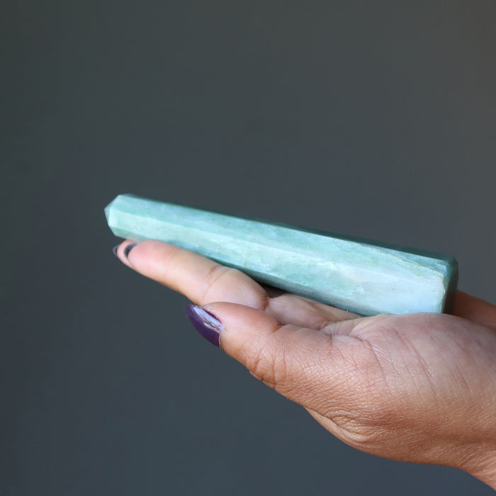 Green Aventurine Tower Wand laying on the palm