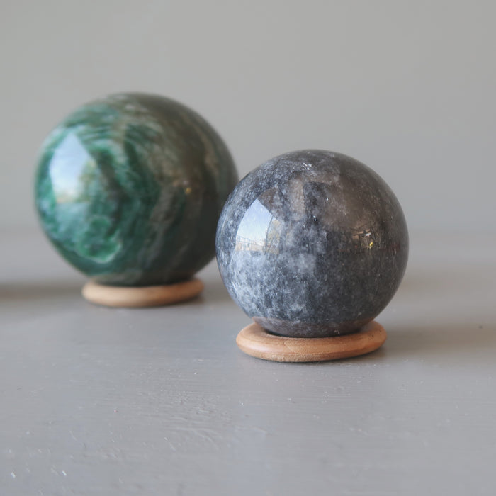 two balls on 2 wood ring stands