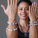 sheila of satin crystals wearing 4 snow white quartz chakra bracelets