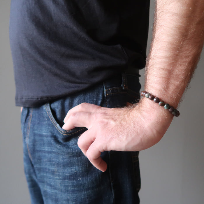 male hand model wearing chrysocolla cuprite bracelet