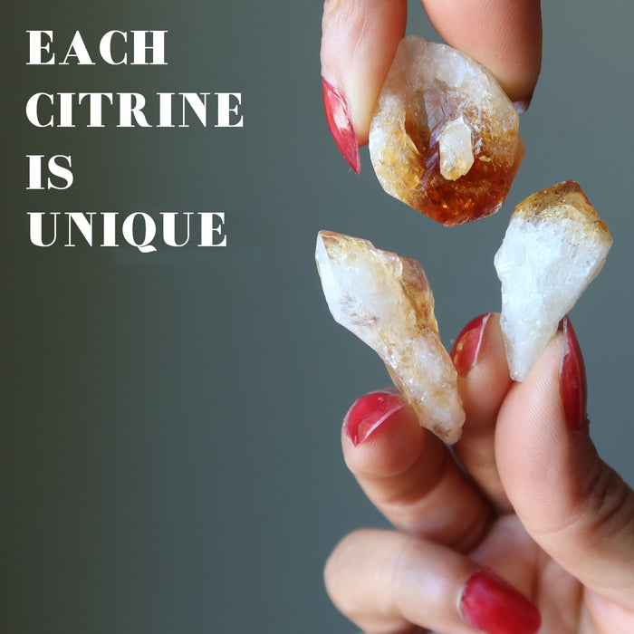 hand holding raw citrine points