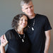 female and male models wearing Howlite and Black Obsidian Necklaces