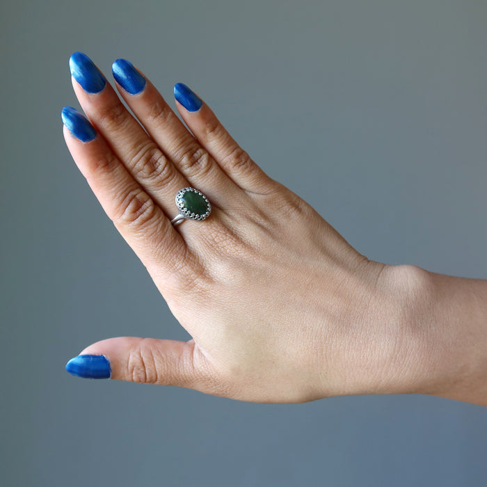 hand wearing a jade sterling silver ring