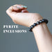 hand wearing jet pyrite bracelet
