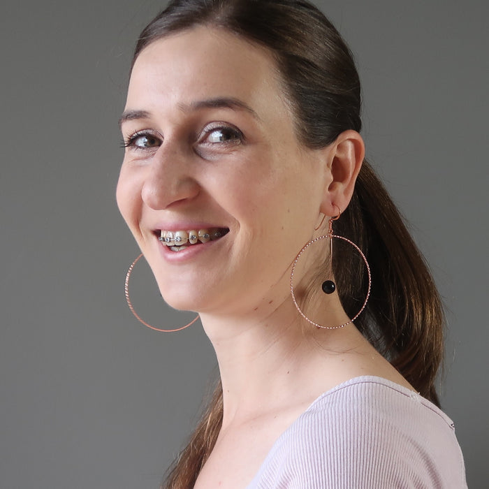 lucia from satin crystals wearing jet stones in big copper hoop earrings