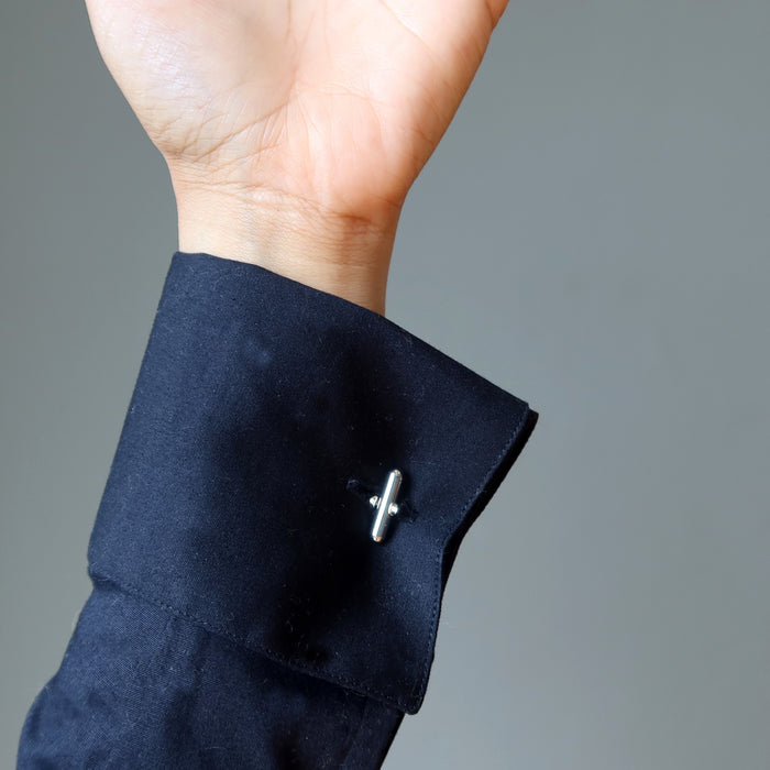 labradorite cufflinks on woman wearing black french cuff shirt