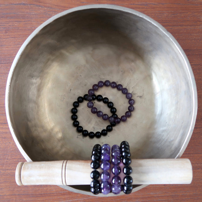 tibetan singing bowl featuring black tourmaline and amethyst bracelet sets
