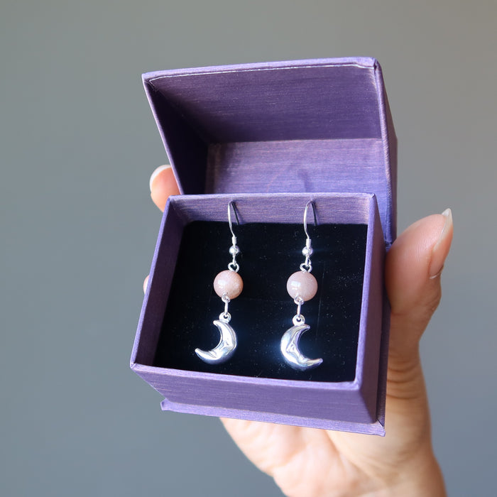 sheila of satin crystals wearing peach moonstone sterling silver crescent moon dangle earrings in purple satin crystals gift box