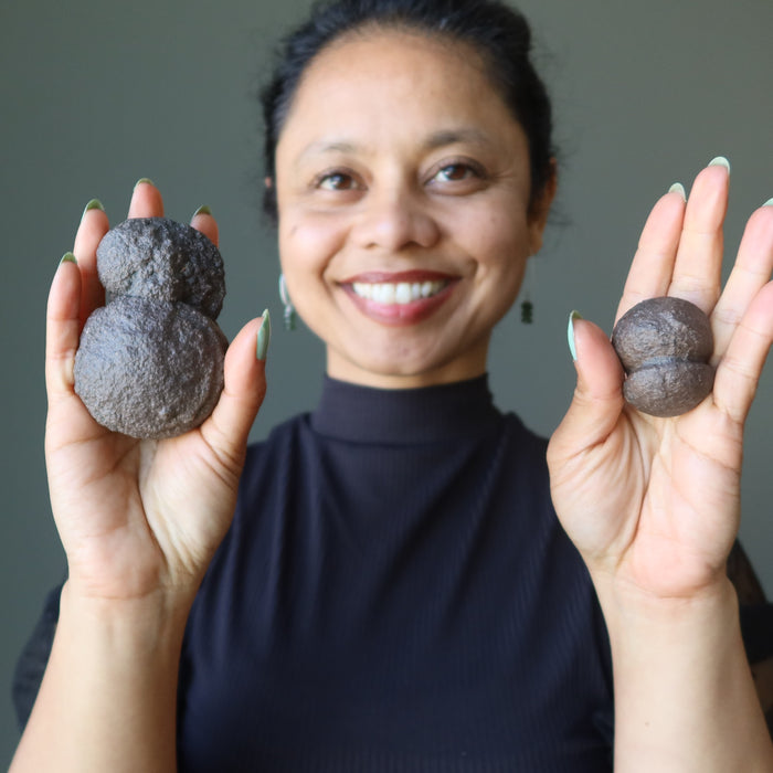 sheila of satin crystals holding two moqui twin stones