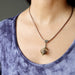 moqui marble stone in vintage cage on antique copper snake chain necklace on female