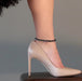 snowflake anklet on a leg in stiletto heels