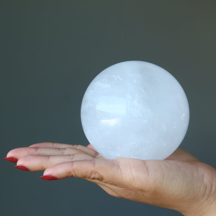 hand holding included quartz sphere
