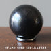 shungite sphere on hematine ring stand which is sold separately