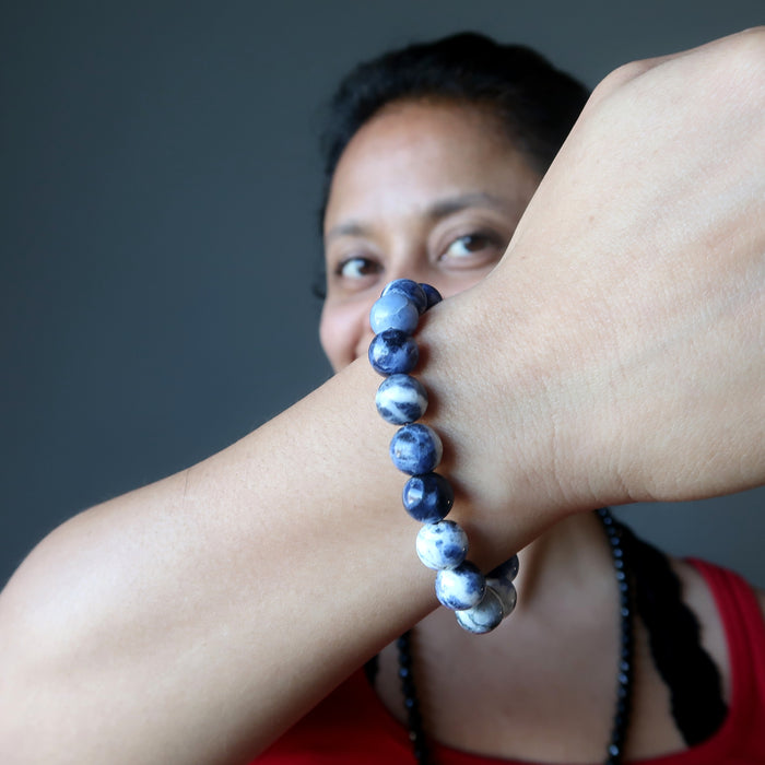 Sheila of Satin Crystals showing her hand made Sodalite bead bracelet on her wrist