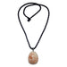 sunstone hangs from a gunmetal bail on a black satin-coated nylon twist cord. The necklace is secured with a knot clasp. 