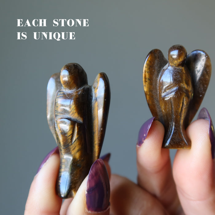 holding two Tigers Eye Angels 