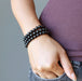 three black tourmaline bracelets on wrist
