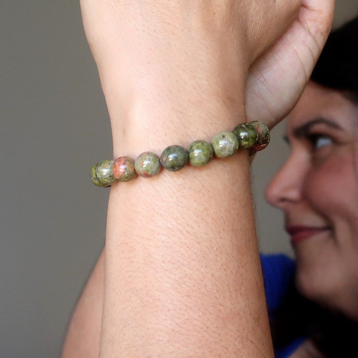 jaren of satin crystals wearing pink and green round unakite beaded stretch bracelet