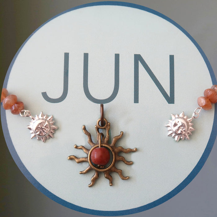 JUN in a circle with sun jewelry pieces