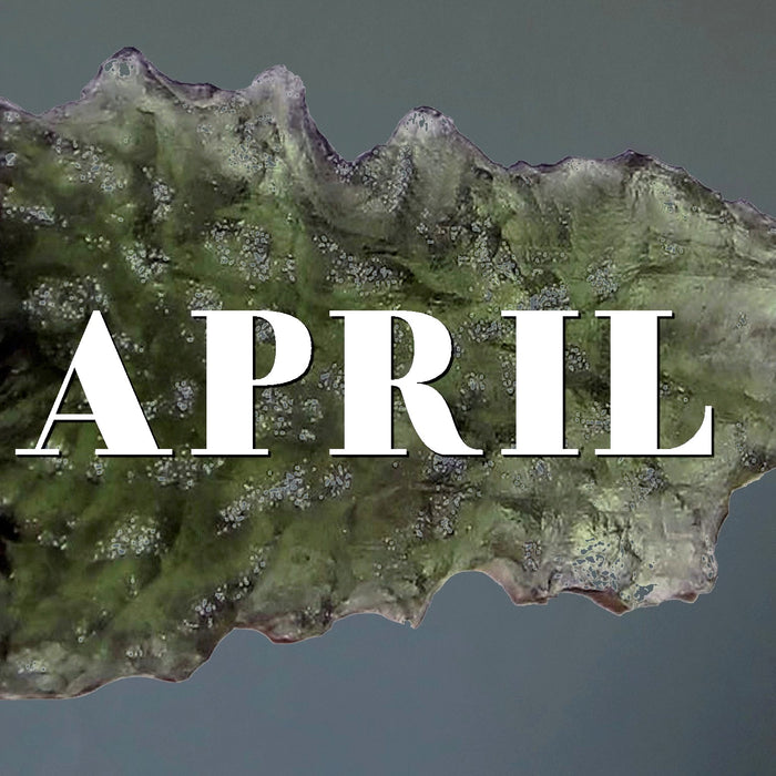 raw moldavite with the word April
