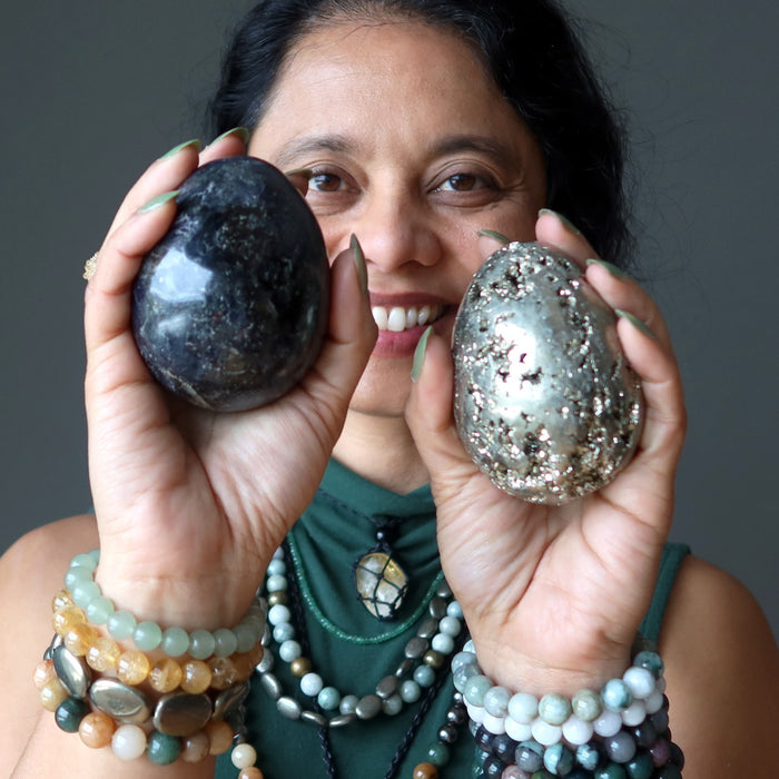 woman holding iolite and pyrite eggs