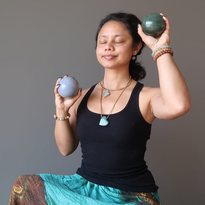 sheila of satin crystals meditating with blue and green aventurine balls