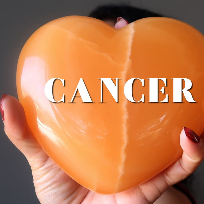orange calcite heart with word CANCER