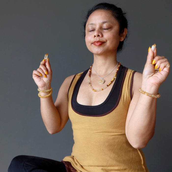sheila of satin crystals meditating with citrine raw points