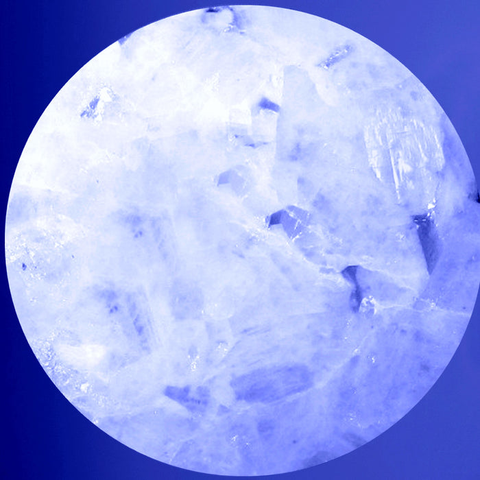 rainbow moonstone sphere on blue background