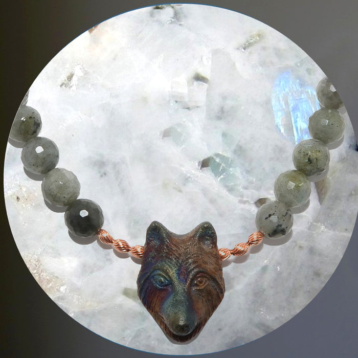 wolf and labradorite necklace around a rainbow moonstone sphere