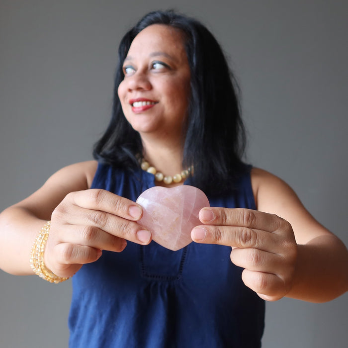 lisa satin holding rose quartz heart