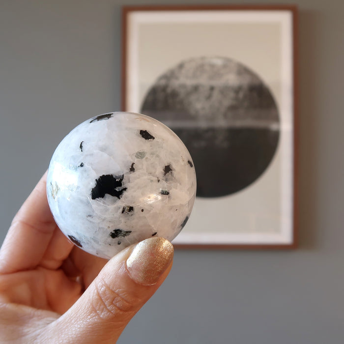 white rainbow moonstone with black tourmaline sphere