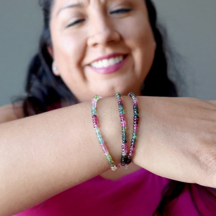 woman wearing faceted rainbow tourmaline bracelets