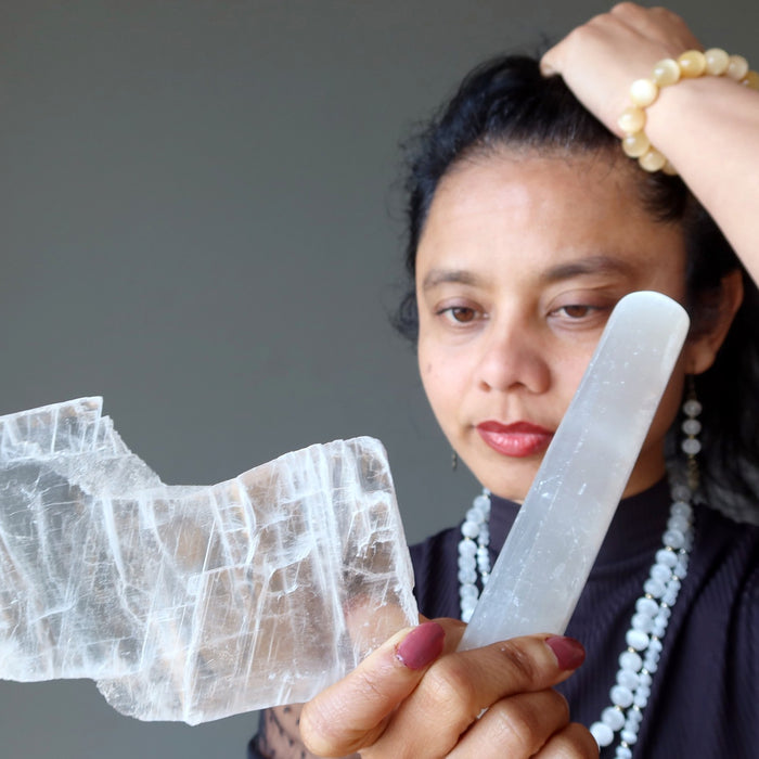 sheila of satin crystals looking at true selenite and satin spar massage wand