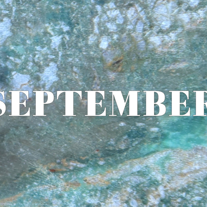 word september on turquoise background