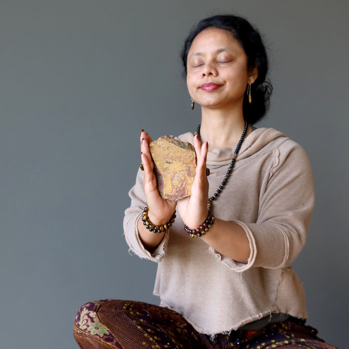 sheila of satin crystals meditating with tigers eye stone