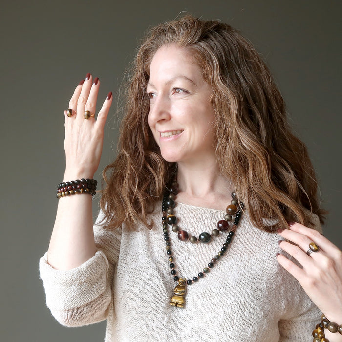 jamie of satin crystals wearing tigers eye rings, bracelets and necklaces