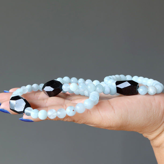 black tourmaline blue aquamarine bracelet on palm