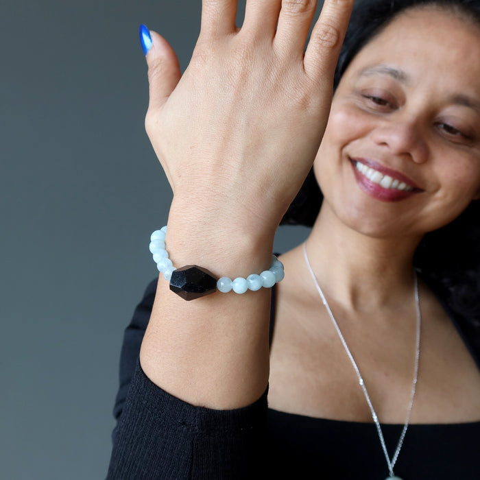 woman wearing black tourmaline blue aquamarine bracelet