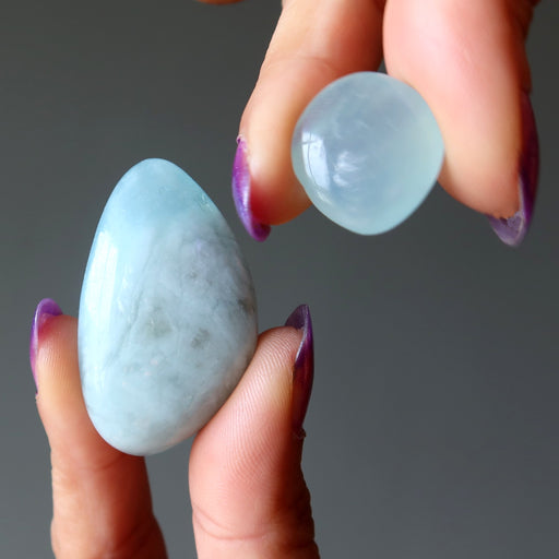 two blue aquamarine tumbled stones