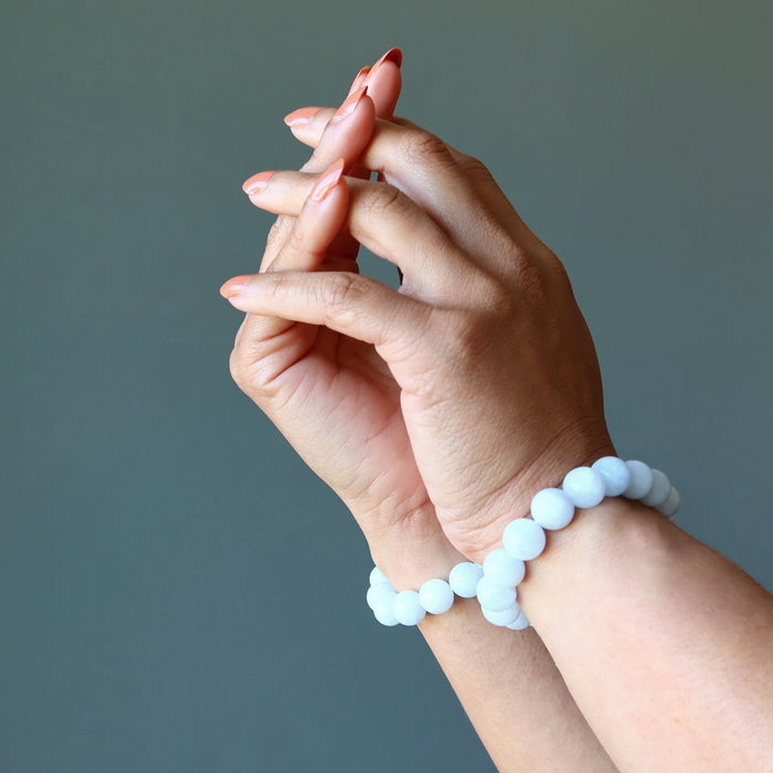 blue calcite bracelets on wrists