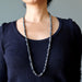 long hematite chip necklace on woman