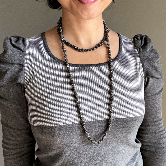 woman wearing hematite necklaces