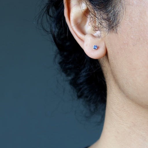 iolite faceted stud earring in ear