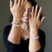 woman wearing two kunzite bracelets