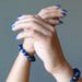 kyanite bracelets on hands