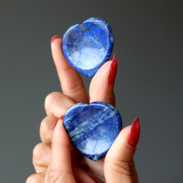 two lapis lazuli worry stone hearts